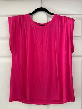 Women's Fuchsia Sleeveless Draped Top with shoulder pads.